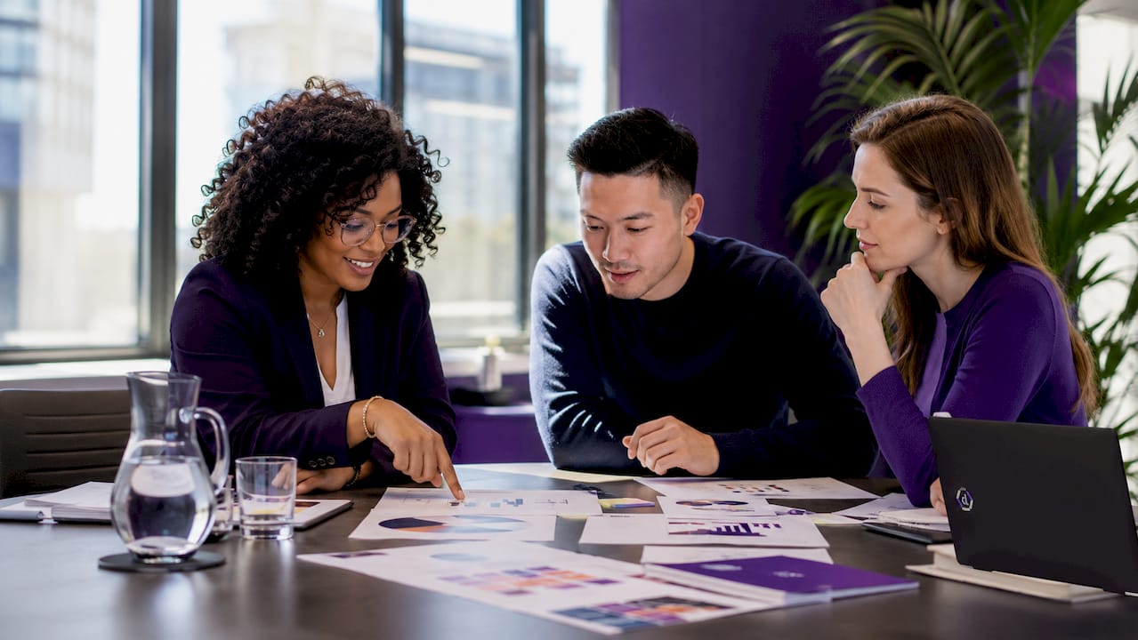 Diverse marketing team collaboratively planning unified campaign