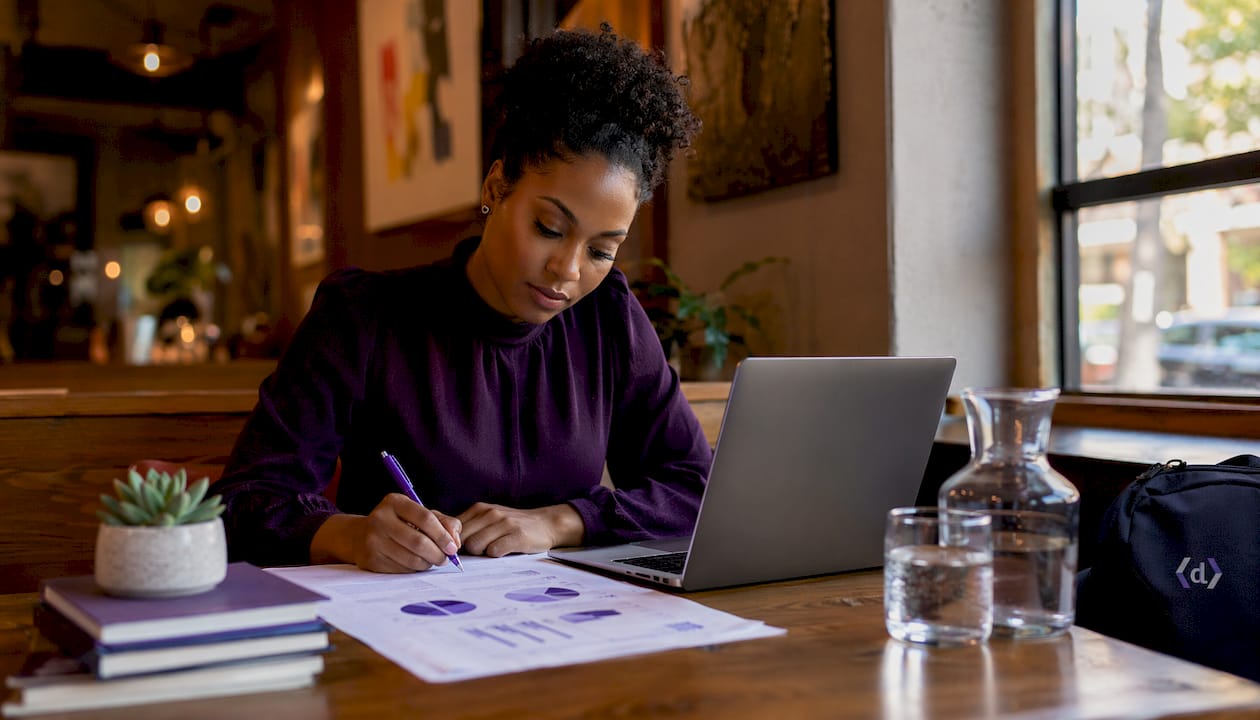 Woman annotating marketing segmentation report