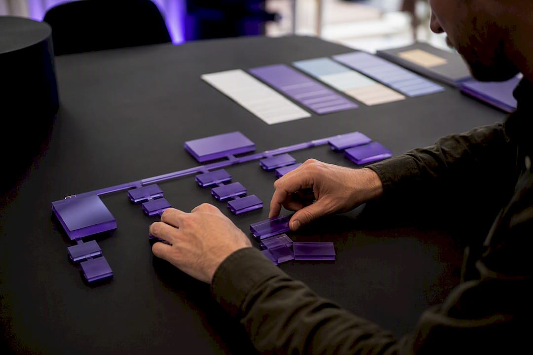 Hands assembling ecommerce site architecture model